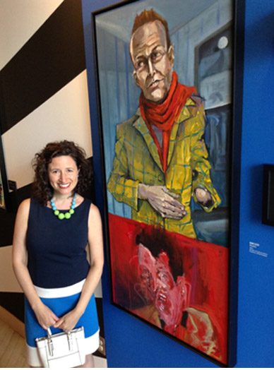 Dana Ellyn standing beside Duality, her two-part portrait of Matt Sesow, at the American Visionary Art Museum in 2016
